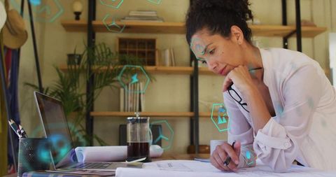 Woman Designing Renewable Energy Solutions in Studio