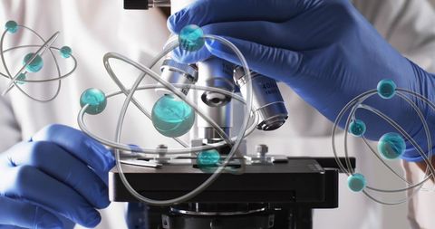 Scientist using microscope with molecule illustrations overlay