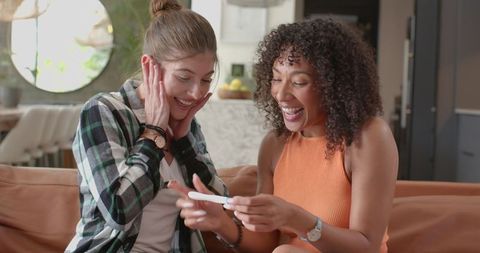 Joyful moment as women celebrate positive pregnancy test at home