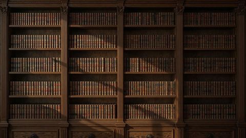 Luxurious antique library with leather-bound books and woodwork