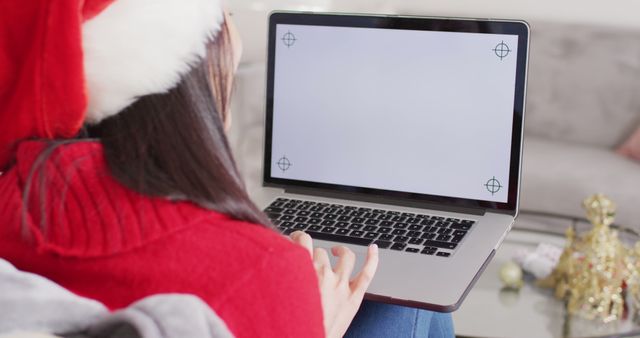 Woman in Santa Hat Using Laptop for Christmas Shopping - Download Free Stock Images Pikwizard.com