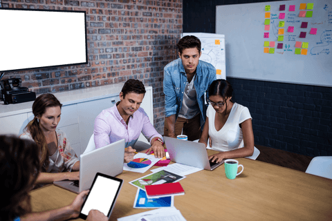 Diverse team collaborating in modern conference room space