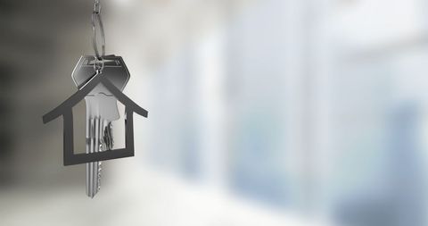 House Keys with Keychain Suspended in Bright Room