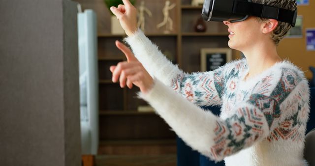 Young Woman Using Virtual Reality Headset for Interactive Experience - Download Free Stock Images Pikwizard.com