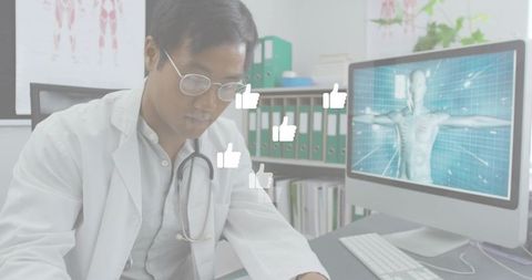 Doctor reviewing patient records at digital workstation with 3d anatomy display