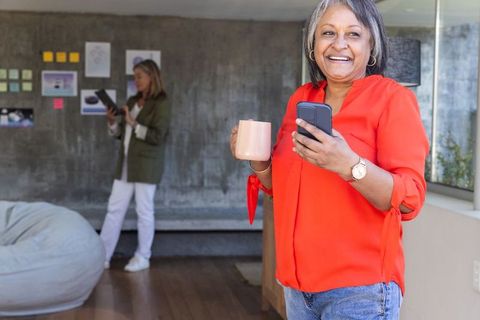 Diverse female professionals brainstorming in modern office
