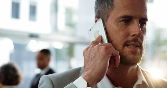 Businessman Taking Phone Call in Modern Office - Download Free Stock Images Pikwizard.com