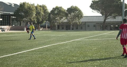 Youth soccer match intense moments on grass field