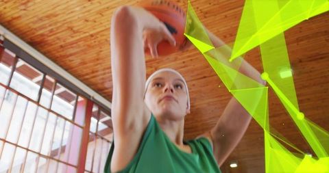 Focus on Female Basketball Player Preparing to Shoot