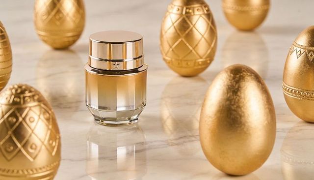 Luxury cosmetic cream jar sitting among golden eggs on polished marble for premium branding