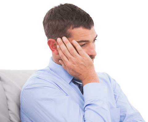 Businessman in a blue shirt looking lost in thought, seated, appearing contemplative. Ideal for use in articles or advertisements focusing on business decision-making, stress management, or promo materials aiming to capture the thought process in a professional setting.