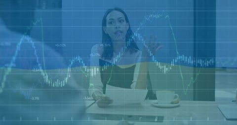 Businesswoman presenting financial data overlaid with u.s. Stock chart