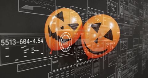 Hovering jack-o'-lantern spheres over futuristic cybersecurity hud and data analytics