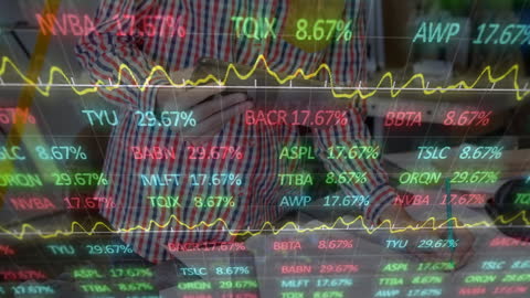 Man Analyzing Digital Financial Data on Computer Screen