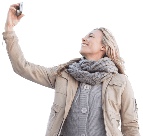Smiling Woman in Warmer Attire Taking Selfie with Transparent Background