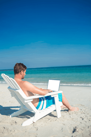 transparent display of man working on laptop relaxing at beach - Download Free Stock Videos Pikwizard.com