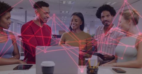 Diverse Team Collaborating in Modern Office with Digital Network Graphic