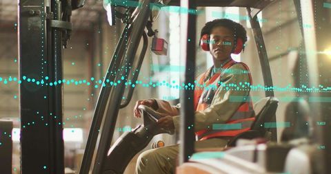 Woman operating forklift with augmented reality data overlay in industrial warehouse