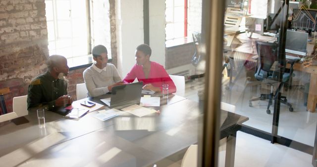 Business team collaborating in modern loft office - Download Free Stock Images Pikwizard.com