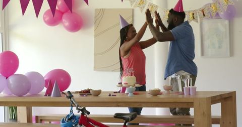 Joyful Birthday Celebration with Balloons and Homemade Cake