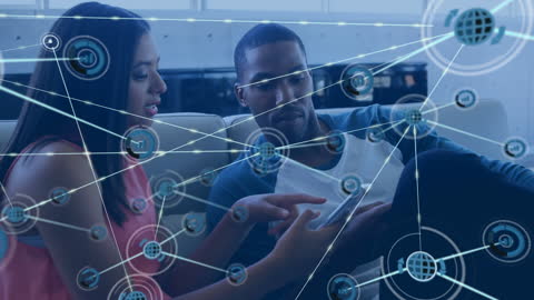 Colleagues Exploring Digital Networks in Office Setting