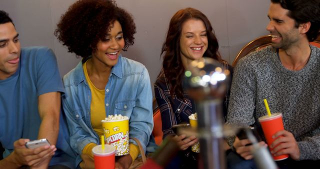 Friends Enjoying Movie Night with Popcorn and Drinks While Using Phones - Download Free Stock Photos Pikwizard.com