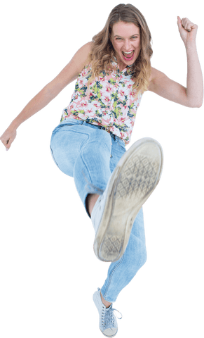 Energetic woman kicking with confident expression on transparent background