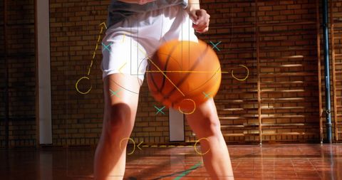 Basketball player dribbling with tactical overlay in indoor court