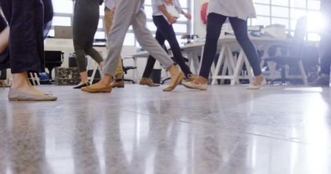 Coworkers Walking in Modern Office for Productive Team Collaboration