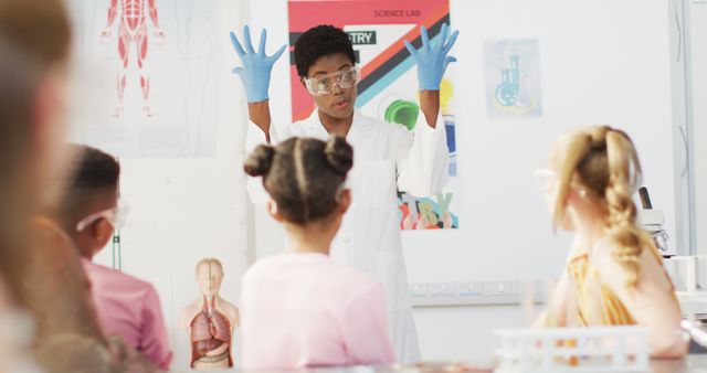 Science Teacher Explaining Experiment to Children in Classroom - Download Free Stock Images Pikwizard.com