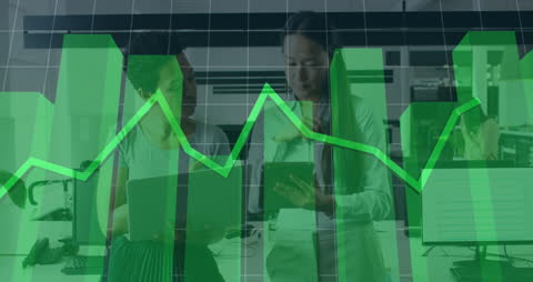 Women Collaborating in Office with Digital Chart Overlay