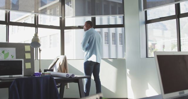 Businessman Contemplating Future by Office Window - Download Free Stock Images Pikwizard.com