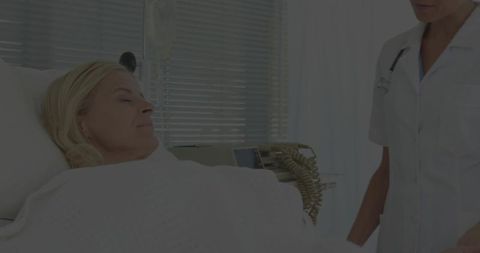 Nurse Checking Patient Vital Signs in Hospital Room