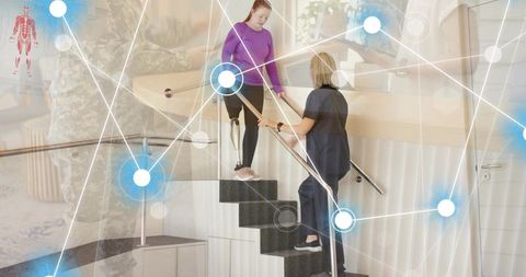 Therapist aiding patient with prosthetic leg in rehabilitation center