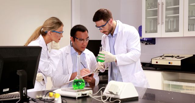 Team of scientists collaborating on research in modern laboratory - Download Free Stock Images Pikwizard.com