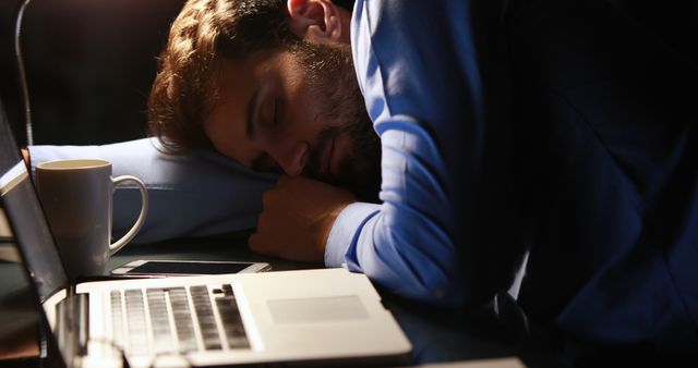 Exhausted Professional Sleeping at Desk During Late Night Work - Download Free Stock Images Pikwizard.com