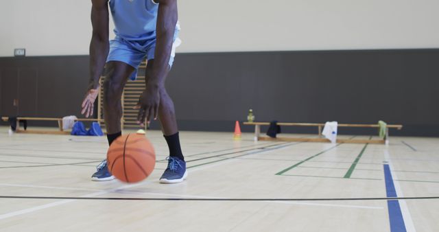 Basketball Player Dribbling During Indoor Practice - Download Free Stock Images Pikwizard.com