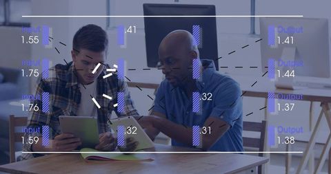 Mentor pointing, explaining tablet to mentee in collaborative office with data overlay