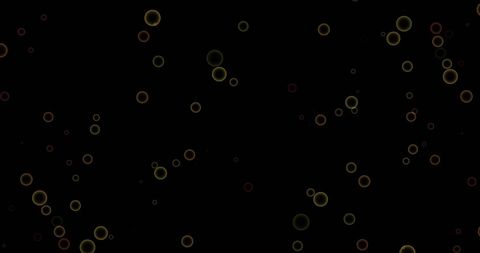 Falling confetti and glowing circle pattern on black background