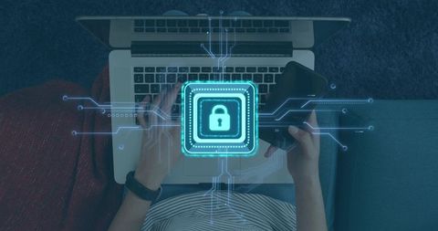 Woman typing on laptop holding smartphone with lock icon representing cybersecurity privacy