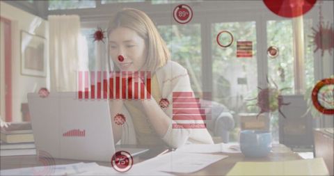 Woman Engaging with Data Visualization on Laptop in Home Office