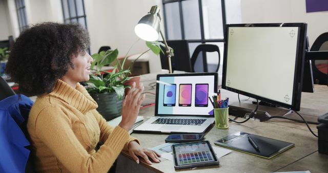 Graphic Designer Engaging in a Video Call While Working on a Design Project - Download Free Stock Images Pikwizard.com