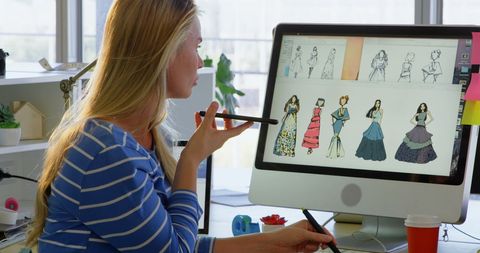 Fashion Designer Consulting While Working on Digital Clothing Illustrations - Download Free Stock Images Pikwizard.com