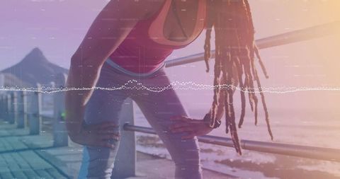 Woman Resting after Workout on Beach Promenade