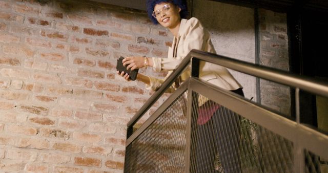 Woman with Book Standing on Modern Staircase - Download Free Stock Images Pikwizard.com