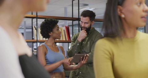 Collaborative Teamwork Discussion in Modern Office Space