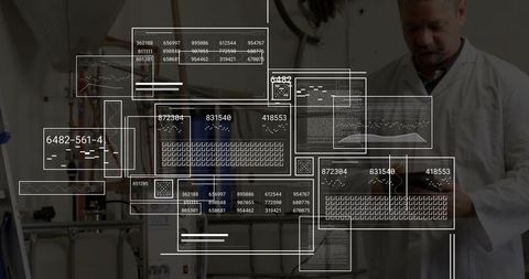 Senior technician inspecting tanks with augmented reality overlays on tablet