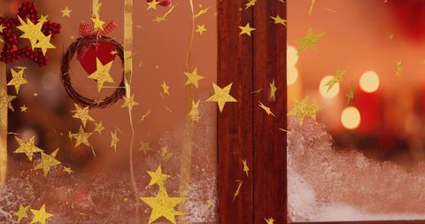 Golden Stars Adorning Festive Christmas Window Scene