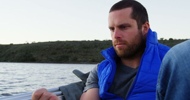 Man Wearing Blue Vest Practicing Safe Boating Habits - Download Free Stock Images Pikwizard.com