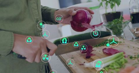 Home cook chopping red onion on cutting board with sustainability icons overlay